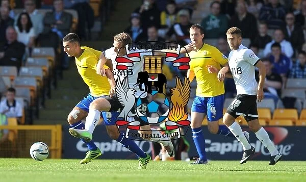 Battle at Vale Park: Thomas vs Birchall in Sky Bet League One Clash - Conor Thomas of Coventry City goes head-to-head with Chris Birchall of Port Vale