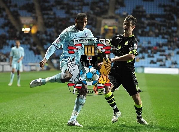 Battleground Ricoh Arena: Coventry City vs. Leeds United - Clive Platt and Danny Pugh's Intense Battle for Control (Npower Championship, 14-02-2012)