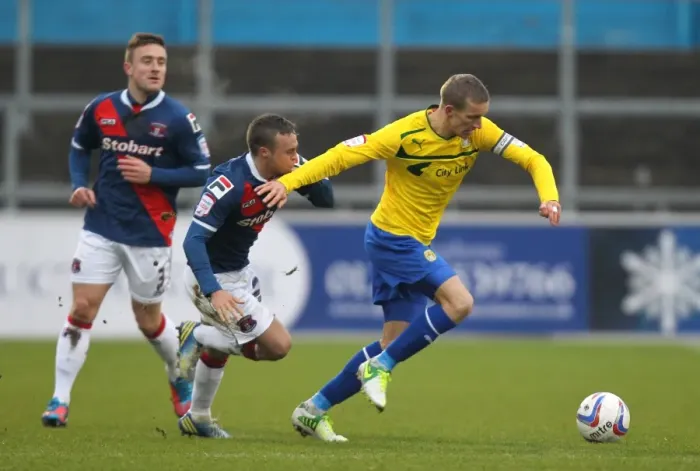 Framed Print : Battling for Control: Chantler vs. Baker in Npower League One Clash Framed Print : Battling for Control: Chantler vs. Baker in Npower League One Clash