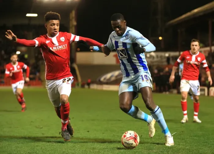 Framed Print : Battling for Control: Holgate vs. Nouble in Sky Bet League One Clash at Oakwell Framed Print : Battling for Control: Holgate vs. Nouble in Sky Bet League One Clash at Oakwell