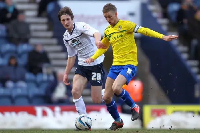 Framed Print : Battling for Possession: Davies vs. Baker in Preston North End vs. Coventry City Framed Print : Battling for Possession: Davies vs. Baker in Preston North End vs. Coventry City