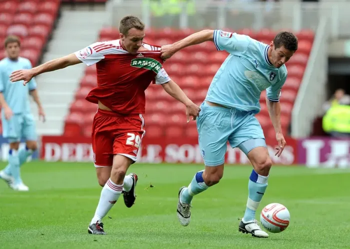 Framed Print : Battling for Supremacy: McMahon vs. Jutkiewicz in the Npower Championship Clash between Middlesbrough and Coventry City Framed Print : Battling for Supremacy: McMahon vs. Jutkiewicz in the Npower Championship Clash between Middlesbrough and Coventry City