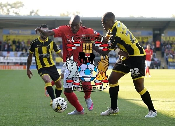 Binnom-Williams vs. Fortune: A Fierce Tackle in Sky Bet League One Clash between Burton Albion and Coventry City