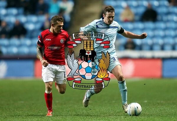 Blair Adams Outmaneuvers Jon Taylor: Coventry City vs. Shrewsbury Town in Npower League One Clash at Ricoh Arena