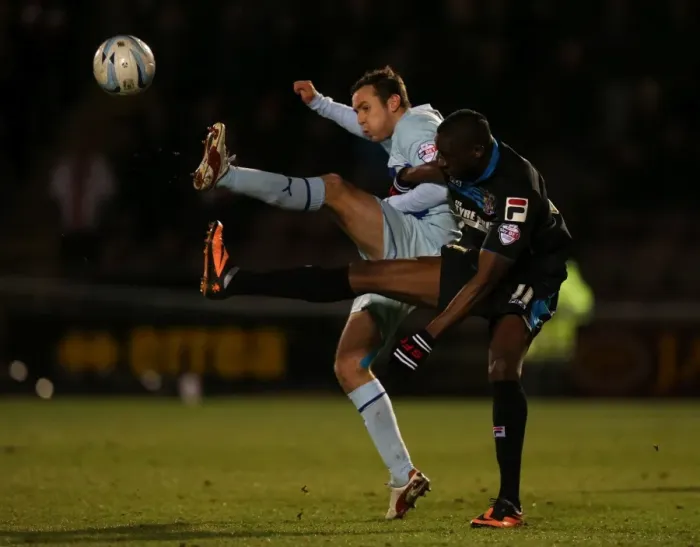 Framed Print : Blair Adams vs Lucas Akins: Intense Rivalry at Sixfields Stadium - Coventry City vs Stevenage (Sky Bet League One, 2014) Framed Print : Blair Adams vs Lucas Akins: Intense Rivalry at Sixfields Stadium - Coventry City vs Stevenage (Sky Bet League One, 2014)