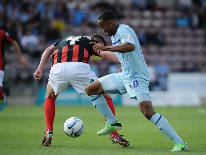 Framed Print : Callum Wilson Outsmarts Paul Huntington: Coventry City vs Preston North End Championship Showdown at Sixfields Stadium