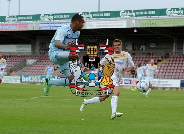 Callum Wilson Sends a Soaring Cross at Sixfields Stadium during Coventry City vs Colchester United (Sky Bet Football League One, 2013)