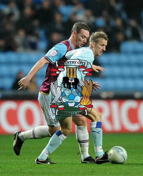 Carl Baker Avoids Glance: Tense Moment between Coventry City's Baker and West Ham's Nolan (Npower Championship, 19-11-2011, Ricoh Arena)