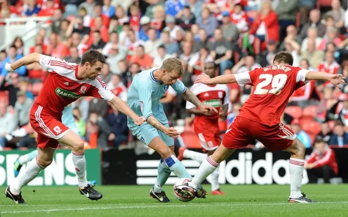 Framed Print : Carl Baker of Coventry City Clashes with Middlesbrough's McManus and McMahon in Championship Match Framed Print : Carl Baker of Coventry City Clashes with Middlesbrough's McManus and McMahon in Championship Match