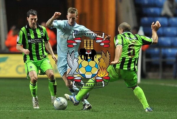 Carl Baker Evades Taricco and El-Abd: Coventry City vs Brighton & Hove Albion in Npower Championship Action