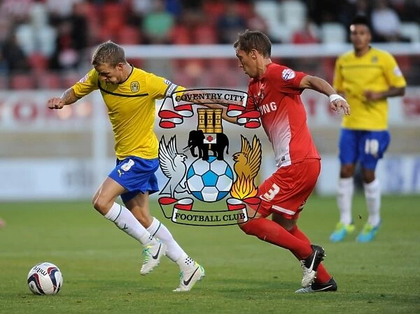 Carl Baker vs Gary Sawyer: Intense Rivalry in the Capital One Cup Clash between Leyton Orient and Coventry City
