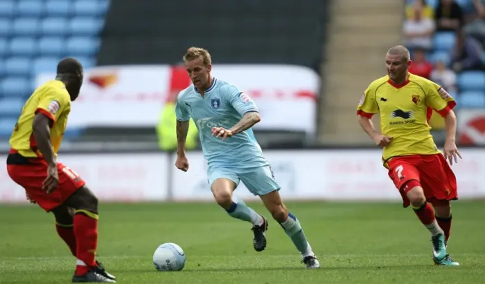Framed Print : Carl Baker vs. Watford Defender: Intense Tackle in Coventry City's Npower Championship Match (August 20, 2011, Ricoh Arena) Framed Print : Carl Baker vs. Watford Defender: Intense Tackle in Coventry City's Npower Championship Match (August 20, 2011, Ricoh Arena)