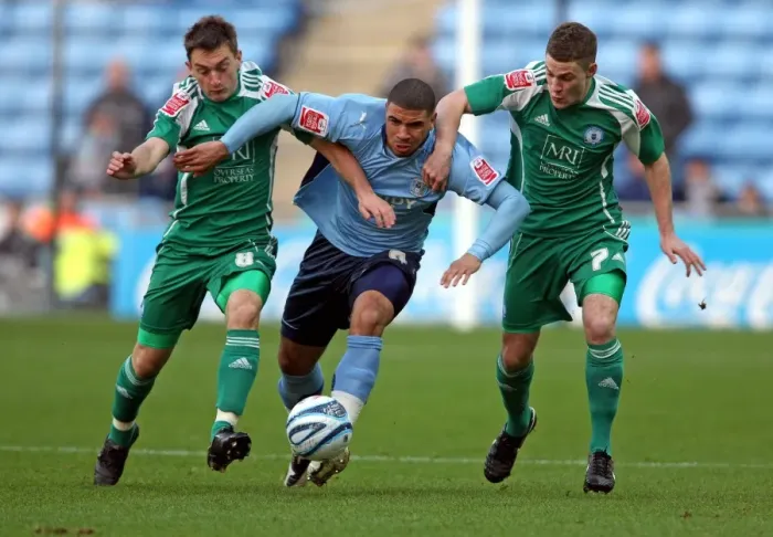 Framed Print : Challenge at Ricoh Arena: Coventry City vs. Peterborough United in Coca-Cola Championship - Leon Best vs. Lee Frecklington and Paul Coutts Framed Print : Challenge at Ricoh Arena: Coventry City vs. Peterborough United in Coca-Cola Championship - Leon Best vs. Lee Frecklington and Paul Coutts