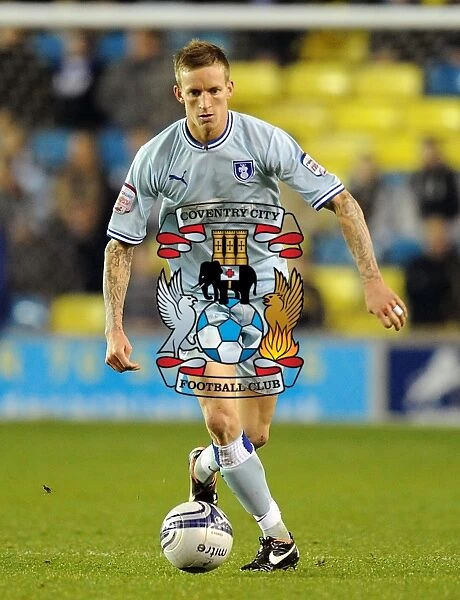 Championship Showdown at The Den: Coventry City vs Millwall - Carl Baker in Action