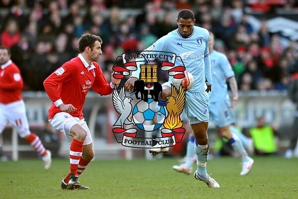 Clash at the City Ground: Platt and Higginbotham's Intense Battle for Ball Supremacy (18-02-2012) - Coventry City vs. Nottingham Forest, Npower Championship