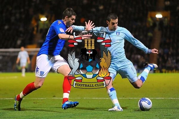 Clash at Fratton Park: A Battle Between Lukas Jutkiewicz and Greg Halford in Coventry City vs. Portsmouth, Npower Championship (03-12-2011)