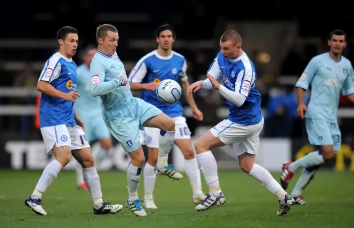 Framed Print : Clash at London Road: McSheffrey vs. Tunnicliffe in Intense Coventry City vs. Peterborough United Npower Championship Showdown Framed Print : Clash at London Road: McSheffrey vs. Tunnicliffe in Intense Coventry City vs. Peterborough United Npower Championship Showdown