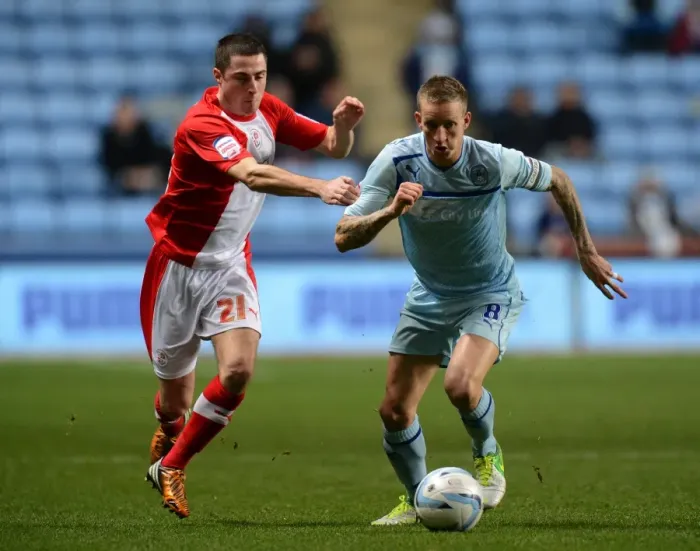 Framed Print : Clash of the Midfielders: Coventry City's Carl Baker vs Crawley Town's Mike Jones (Football League One, Ricoh Arena, 06-11-2012)