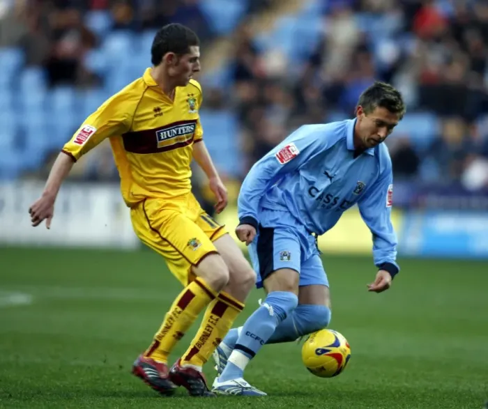 Framed Print : Clash of the Midfielders: Darren Currie vs. Chris McCann (Coventry City vs. Burnley, 09-12-2006) Framed Print : Clash of the Midfielders: Darren Currie vs. Chris McCann (Coventry City vs. Burnley, 09-12-2006)