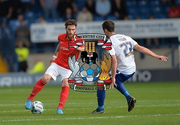 Clash on the Pitch: A Sky Bet League One Battle between Romain Vincelot and Danny Pugh at Gigg Lane