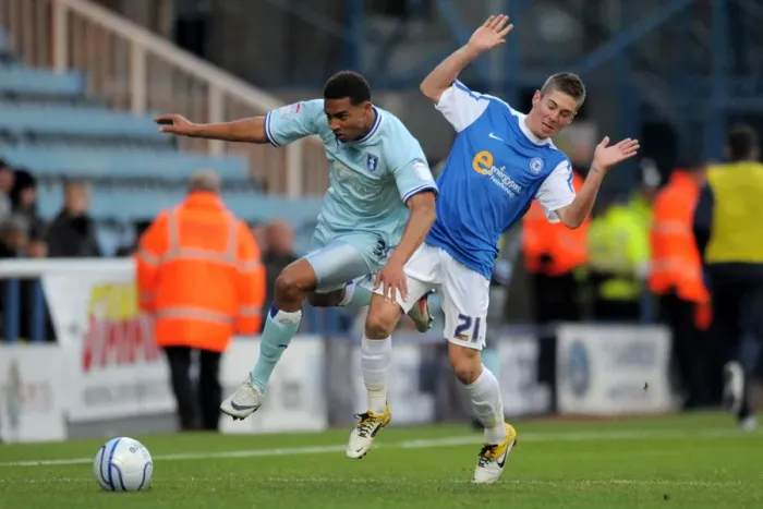 Framed Print : Clash of the Titans: Cyrus Christie vs Daniel Kearns, Coventry City vs Peterborough United (Npower Championship, 17-12-2011, London Road) Framed Print : Clash of the Titans: Cyrus Christie vs Daniel Kearns, Coventry City vs Peterborough United (Npower Championship, 17-12-2011, London Road)