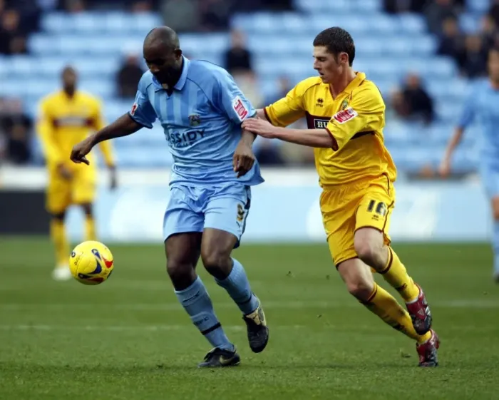 Framed Print : Clash of the Titans: Dale Adebola vs. Chris McCann, Coventry City vs. Burnley (09-12-2006, Ricoh Arena) Framed Print : Clash of the Titans: Dale Adebola vs. Chris McCann, Coventry City vs. Burnley (09-12-2006, Ricoh Arena)