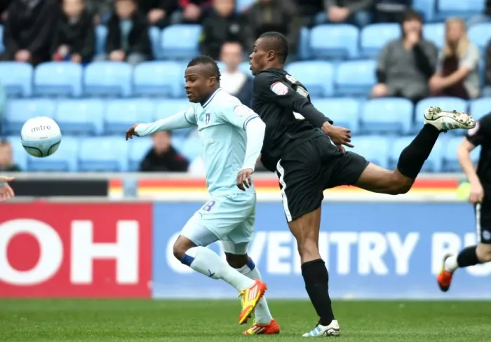 Framed Print : Clash of Titans: Nimely vs. Zakuani in Coventry City vs. Peterborough United Championship Showdown at Ricoh Arena Framed Print : Clash of Titans: Nimely vs. Zakuani in Coventry City vs. Peterborough United Championship Showdown at Ricoh Arena