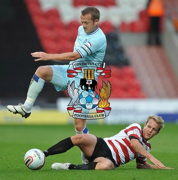Clingan vs. Coppinger: Intense Tackle in Coventry City vs. Doncaster Rovers Championship Clash