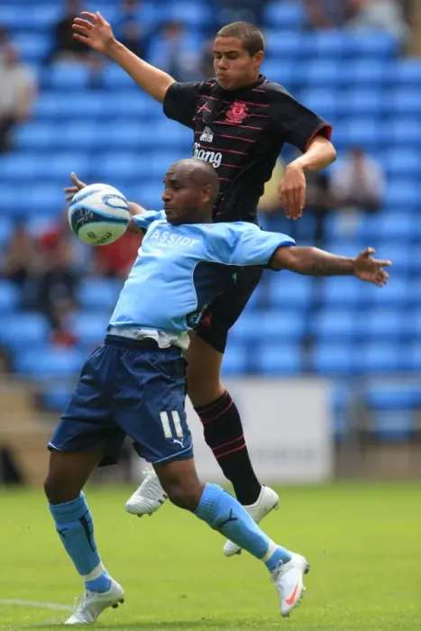 Framed Print : Clinton Morrison vs. Jack Rodwell: Intense Battle for the Ball in Coventry City's Pre-Season Friendly against Everton (August 2, 2009, Ricoh Arena) Framed Print : Clinton Morrison vs. Jack Rodwell: Intense Battle for the Ball in Coventry City's Pre-Season Friendly against Everton (August 2, 2009, Ricoh Arena)