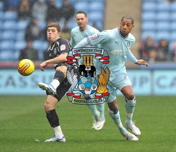 Clive Platt's Determined Battle for Possession: Coventry City vs Ipswich Town, Championship Showdown at Ricoh Arena (04-02-2012)