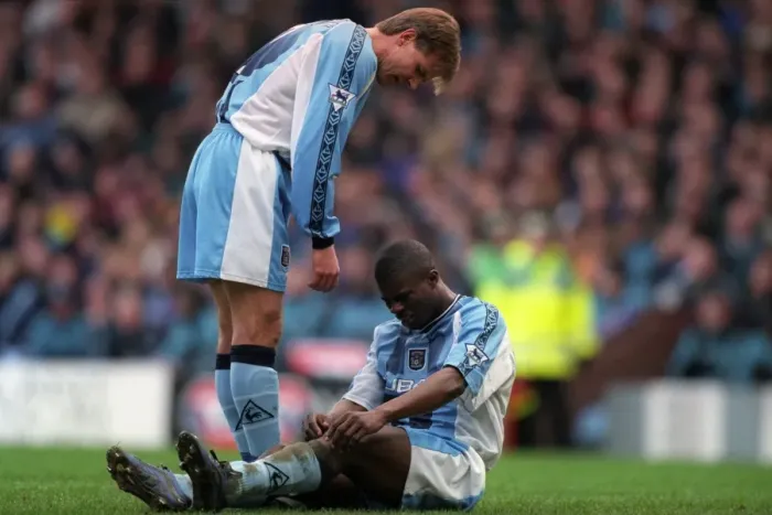 Framed Print : Comfort and Care: Roland Nilsson Consoles Injured George Boateng on the Field (FA Carling Premiership: Aston Villa vs Coventry City, 1999) Framed Print : Comfort and Care: Roland Nilsson Consoles Injured George Boateng on the Field (FA Carling Premiership: Aston Villa vs Coventry City, 1999)