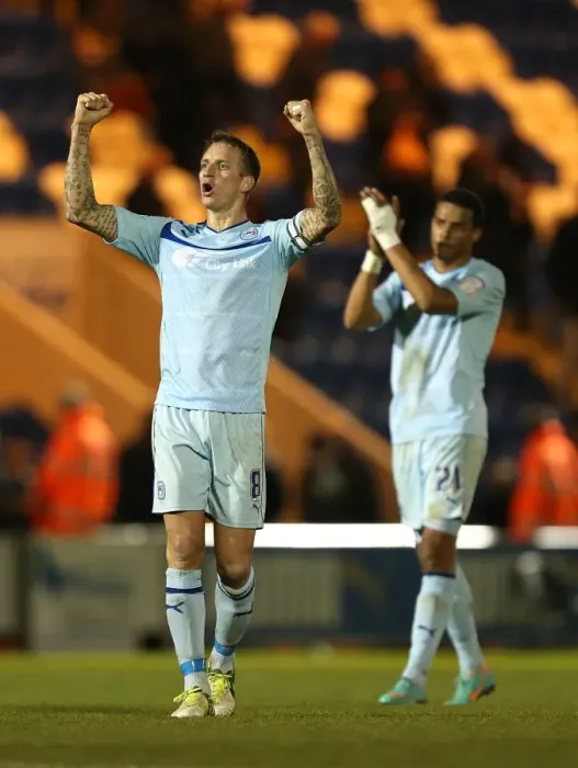 Framed Print : Coventry City FC: Celebrating Promotion - Baker and Christie's Triumphant Moment after Winning against Colchester United in Npower League One