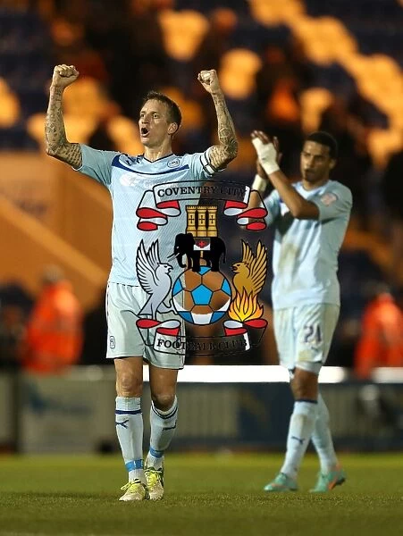 Coventry City FC: Celebrating Promotion - Baker and Christie's Triumphant Moment after Winning against Colchester United in Npower League One