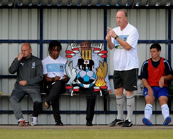 Coventry City FC: Manager Andy Thorn and Coaches Steve Ogrizovic, Richard Shaw, and Lee Carsley Give Team Instructions at Nuneaton Town's Liberty Way Stadium