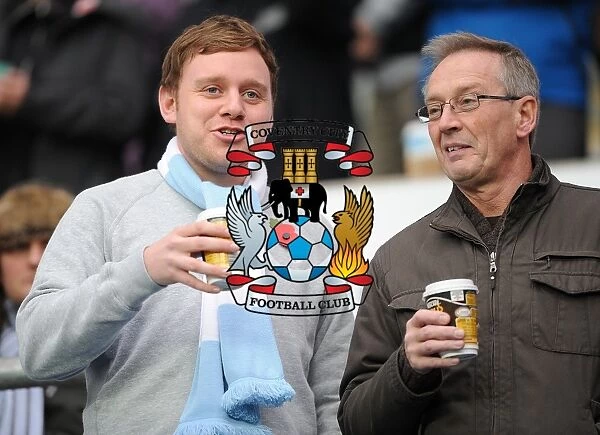 Coventry City Football Club: A Cozy Npower Championship Moment - Fans Savoring Hot Drinks at Ricoh Arena