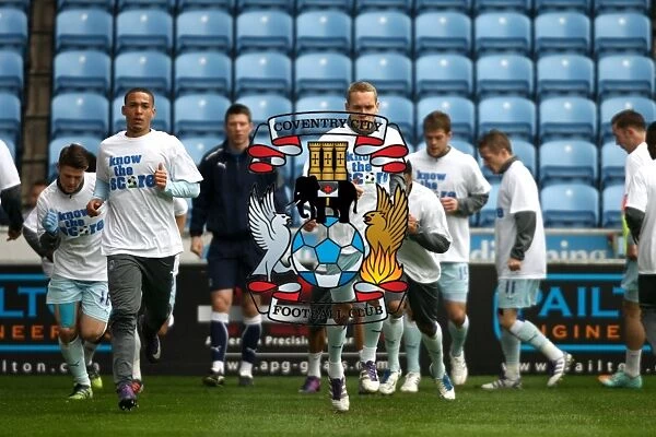 Coventry City Players Warm Up in Know the Score T-Shirts before Npower Championship Match