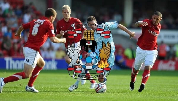 Coventry City vs Barnsley: Lucas Jutkiewicz Faces Off Against Stephen Foster and Nathan Doyle at Oakwell Stadium, Npower Football League Championship (1st October 2011)