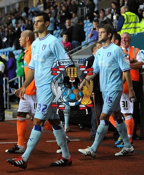 Coventry City vs Blackpool: Conor Thomas and Martin Cranie with Mascot Before Kick-off in Npower Championship (27-09-2011, Ricoh Arena)