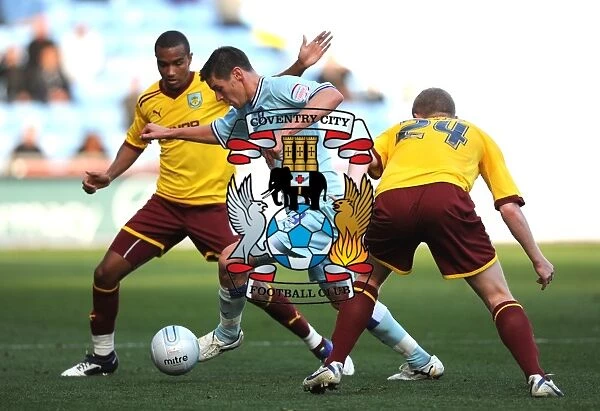 Coventry City vs Burnley: Lukas Jutkiewicz Fights for Possession in Npower Championship Match