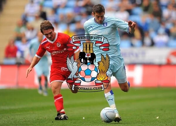 Coventry City vs. Reading: Clash between Lukas Jutkiewicz and Jay Tabb in the Npower Championship at Ricoh Arena