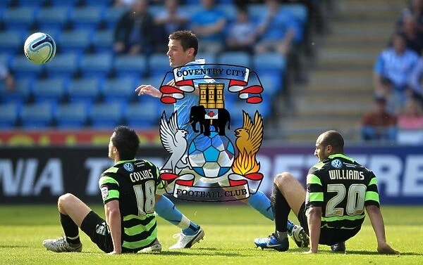 Coventry City vs Scunthorpe United: Intense Moment at the Ricoh Arena - Lukas Jutkiewicz vs Michael Collins and Marcus Williams (Npower Football League Championship, 22-04-2011)