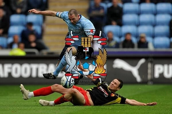 Coventry City vs. Watford: Battle for the Ball - Stephen Wright Leaps Clear of Don Cowie (Championship, 02-05-2010)