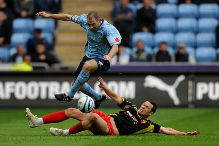 Framed Print : Coventry City vs. Watford: Battle for the Ball - Stephen Wright Leaps Clear of Don Cowie (Championship, 02-05-2010) Framed Print : Coventry City vs. Watford: Battle for the Ball - Stephen Wright Leaps Clear of Don Cowie (Championship, 02-05-2010)