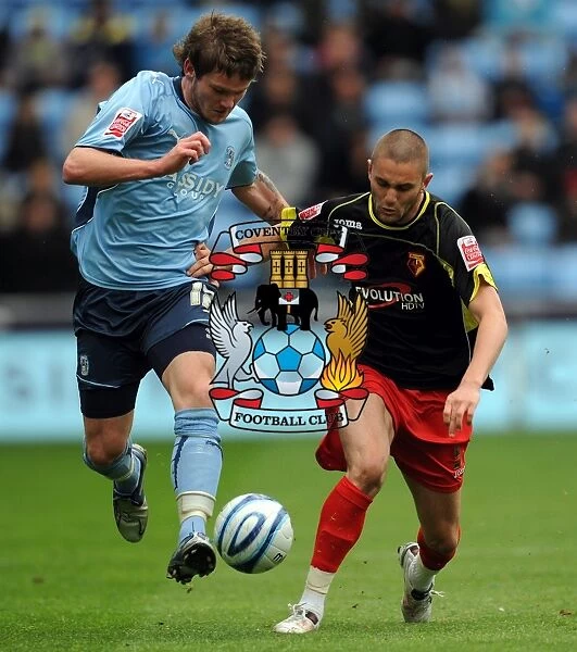 Coventry City vs Watford: Intense Battle for the Ball in the Championship - Aron Gunnarsson vs Henri Lansbury (Ricoh Arena, 02-05-2010)