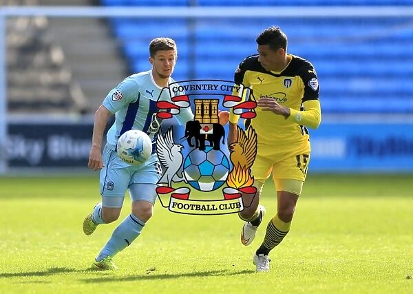 Coventry Citys Aarom Phillips (left) and Colchester Uniteds Matthew Briggs battle for the ball