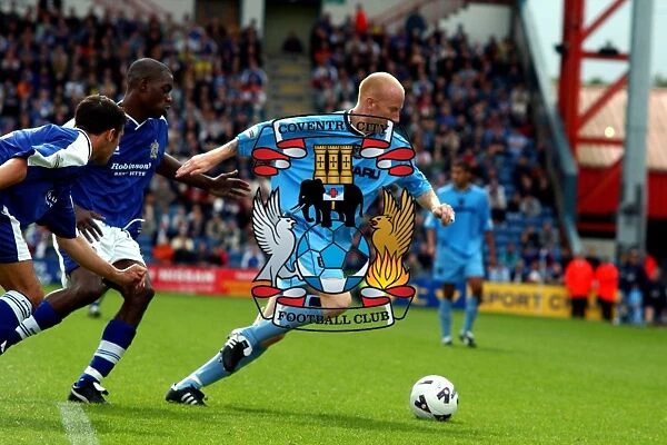 Coventry City's Lee Hughes: Fending Off Stockport Defenders Amidst Division One Momentum (11-08-2001)