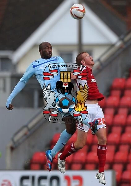Coventry City's Nathan Cameron Outjumps Swindon Town's Adam Rooney: A Head-to-Head Battle in Npower League One