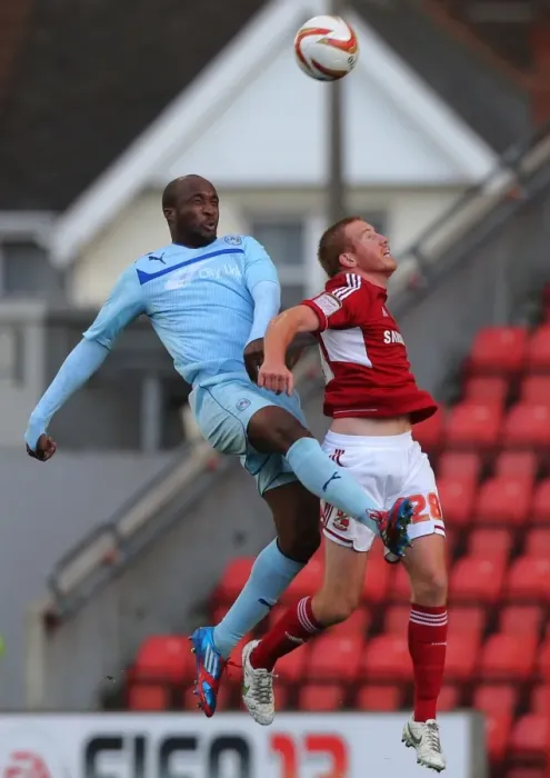 Framed Print : Coventry City's Nathan Cameron Outjumps Swindon Town's Adam Rooney: A Head-to-Head Battle in Npower League One