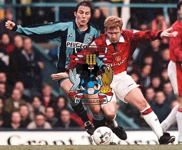 Coventry v Man Untd. Noel Whelan and Paul Scholes fight for possession