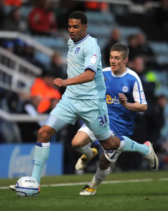 Framed Print : Cyrus Christie Evas Action: Coventry City vs. Peterborough United in Npower Championship Framed Print : Cyrus Christie Evas Action: Coventry City vs. Peterborough United in Npower Championship
